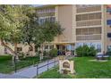 Building exterior with landscaping, showing building number and entrance at 3164 S Wheeling Way # 306, Aurora, CO 80014