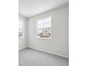Bright bedroom with neutral walls and carpet flooring at 819 Goodrich Peak St, Erie, CO 80516