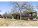 Exterior shot of a home featuring a modern design with ample landscaping at 5200 W Ottawa Ave, Littleton, CO 80128