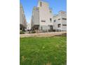 Modern home exterior showcasing well-maintained front lawn and contemporary architectural design at 1284 Quitman St, Denver, CO 80204