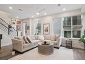 Inviting living room featuring a large sectional sofa and a stylish rug at 1284 Quitman St, Denver, CO 80204