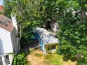 Aerial view of the private backyard with lush greenery surrounding the cozy home at 160 Monroe St, Denver, CO 80206