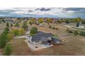 Aerial view showcasing house with backyard patio and landscaping at 12628 N 3Rd St, Parker, CO 80134