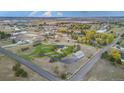 Expansive aerial view of estate with white fencing, lush landscaping, barn and sprawling grounds at 12628 N 3Rd St, Parker, CO 80134