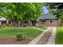 Beautiful home surrounded by mature trees and lush landscaping, offering a serene setting at 1380 Magnolia St, Denver, CO 80220