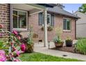 Inviting front porch with decorative planters and seating area, enhancing the home's entrance at 1380 Magnolia St, Denver, CO 80220