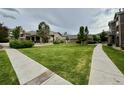 Image showcasing the well-maintained front lawn and landscaping surrounding the residential property at 7440 S Blackhawk St # 208, Englewood, CO 80112