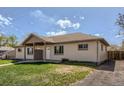 A well-maintained duplex with a charming porch and a lush, green lawn at 1121 Rogers St, Golden, CO 80401