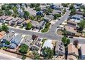 An elevated view of a well-kept neighborhood showcasing homes with neat landscaping and organized street layouts at 8847 Cloverleaf Cir, Parker, CO 80134