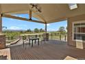 Expansive covered deck with views of the fenced backyard and lovely landscaping at 1975 Wild Star Way, Castle Rock, CO 80104