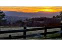 Scenic mountain view at sunset, showcasing the serene landscape and natural beauty of the property's surroundings at 1975 Wild Star Way, Castle Rock, CO 80104