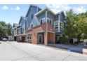 Modern townhome boasts a stylish brick facade and contemporary design at 1320 S Monaco St Pkwy # 3, Denver, CO 80224