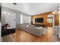 Cozy living room with hardwood floors, natural light, and a neutral color scheme at 1325 Dayton St, Aurora, CO 80010