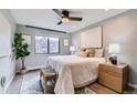 Bright bedroom with a large window, cozy rug, and decorative details that complement the calm atmosphere at 1008 N Corona St # 205, Denver, CO 80218