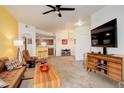 Open-concept layout featuring a breakfast bar connecting the living room to the kitchen at 5723 N Gibralter Way # 205, Aurora, CO 80019