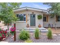 Close up front entrance with beautifully landscaped small trees and healthy flowering garden at 250 W Midway Blvd, Broomfield, CO 80020