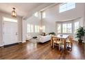 Bright living area featuring a hardwood floor, and large windows with an open and airy atmosphere at 4970 Laurelglen Ln, Highlands Ranch, CO 80130