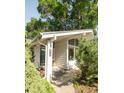 Charming front entrance with a slate tiled porch and decorative glass front door at 950 Everett St, Lakewood, CO 80215