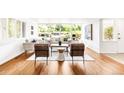 Bright living room with hardwood floors, modern furniture, and large windows, creating a comfortable and inviting space at 950 Everett St, Lakewood, CO 80215