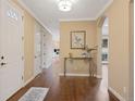 Welcoming foyer with hardwood floors, neutral walls, and elegant decor at 8155 W Tennessee Dr, Lakewood, CO 80226