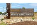 Community entrance sign for Green Valley Ranch Golf Course, with stone accents and manicured landscaping at 3940 Malaya St, Denver, CO 80249