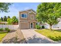 Two-story home featuring a well-kept lawn, driveway, and attractive exterior at 18672 E Chaffee Pl, Denver, CO 80249