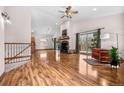 Spacious living room with vaulted ceilings, hardwood floors, fireplace, and sliding doors to the deck at 459 Virginia Ave, Palmer Lake, CO 80133