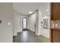 Spacious foyer with tile flooring, leading to the living areas and kitchen at 6334 S Elati St, Littleton, CO 80120