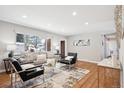 Bright living room featuring hardwood floors and a cozy seating area at 3931 S Uinta St, Denver, CO 80237