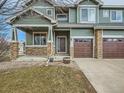 Charming two-story home with a two-car garage, stone accents, and a covered front porch at 4941 Silverleaf Ave, Firestone, CO 80504