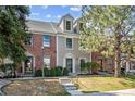 Well-kept townhomes boast brick and siding exteriors, complemented by lush greenery and inviting front entrances at 5708 E 10Th Ave, Denver, CO 80220