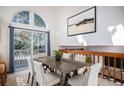 Bright dining room with sliding glass doors leading to a deck at 1147 S Flower Cir, Lakewood, CO 80232