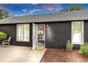 Inviting home exterior with an open front door revealing a glimpse of the bright interior at 211 E Emma St, Lafayette, CO 80026