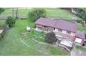 Aerial view of home featuring a spacious backyard, deck, and mature trees at 5870 Nelson Ct, Arvada, CO 80004