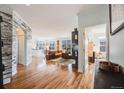 Bright and spacious living room with hardwood floors and stylish accents at 111 S Monroe St # B203, Denver, CO 80209