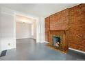 Bright living room featuring a fireplace and hardwood floors at 2219 W 33Rd Ave, Denver, CO 80211