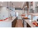 Spacious kitchen boasts a large island, stainless steel appliances, and stylish pendant lights at 8 S Colorado Blvd, Denver, CO 80246