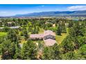 A beautiful, serene aerial shot showcasing mountain views and the surrounding landscape at 18680 Knollwood Blvd, Monument, CO 80132