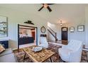 Open-concept entry and living room with natural light and elegant finishes at 18680 Knollwood Blvd, Monument, CO 80132