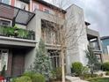 Beautiful townhome showcasing a private balcony, modern design, and well-maintained landscaping at 4280 E Warren Ave # 2, Denver, CO 80222