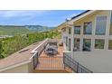 Enjoy scenic views from this rooftop deck with ample seating, perfect for entertaining and relaxation at 17313 W 43Rd Dr, Golden, CO 80403