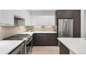 Well-equipped kitchen featuring stainless steel appliances and modern cabinetry and countertops at 1815 N Williams St, Denver, CO 80218