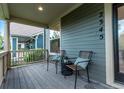 Relaxing front porch offers comfortable seating and neighborhood views at 2345 Akron St, Denver, CO 80238
