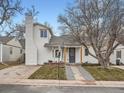 Beautiful home with a walkway, chimney and a mature tree in the front yard at 2310 Willow Creek Dr, Golden, CO 80401