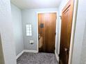 Entryway featuring decorative glass block, tiled floors, and classic wooden door at 2710 Stuart St, Denver, CO 80212