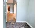 Entryway featuring archway to other rooms, tiled floors, and original details at 2710 Stuart St, Denver, CO 80212