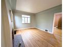 Spacious living room with hardwood floors, neutral walls, and abundant natural light at 2710 Stuart St, Denver, CO 80212