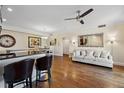 Bright living room with wood floors, neutral colors, ceiling fan, and stylish furnishings, creating a warm atmosphere at 2121 Enterprise St, Superior, CO 80027