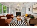 Bright living room features a fireplace, checkered rug, and modern seating at 405 S University Blvd, Denver, CO 80209