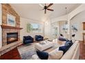 Spacious living room featuring vaulted ceilings, fireplace, and ample natural light at 1890 Bel Lago Vw, Monument, CO 80132
